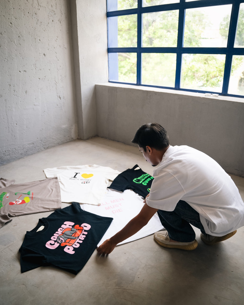 Founder of Set Money On Fire reviewing the brand's clothing collection